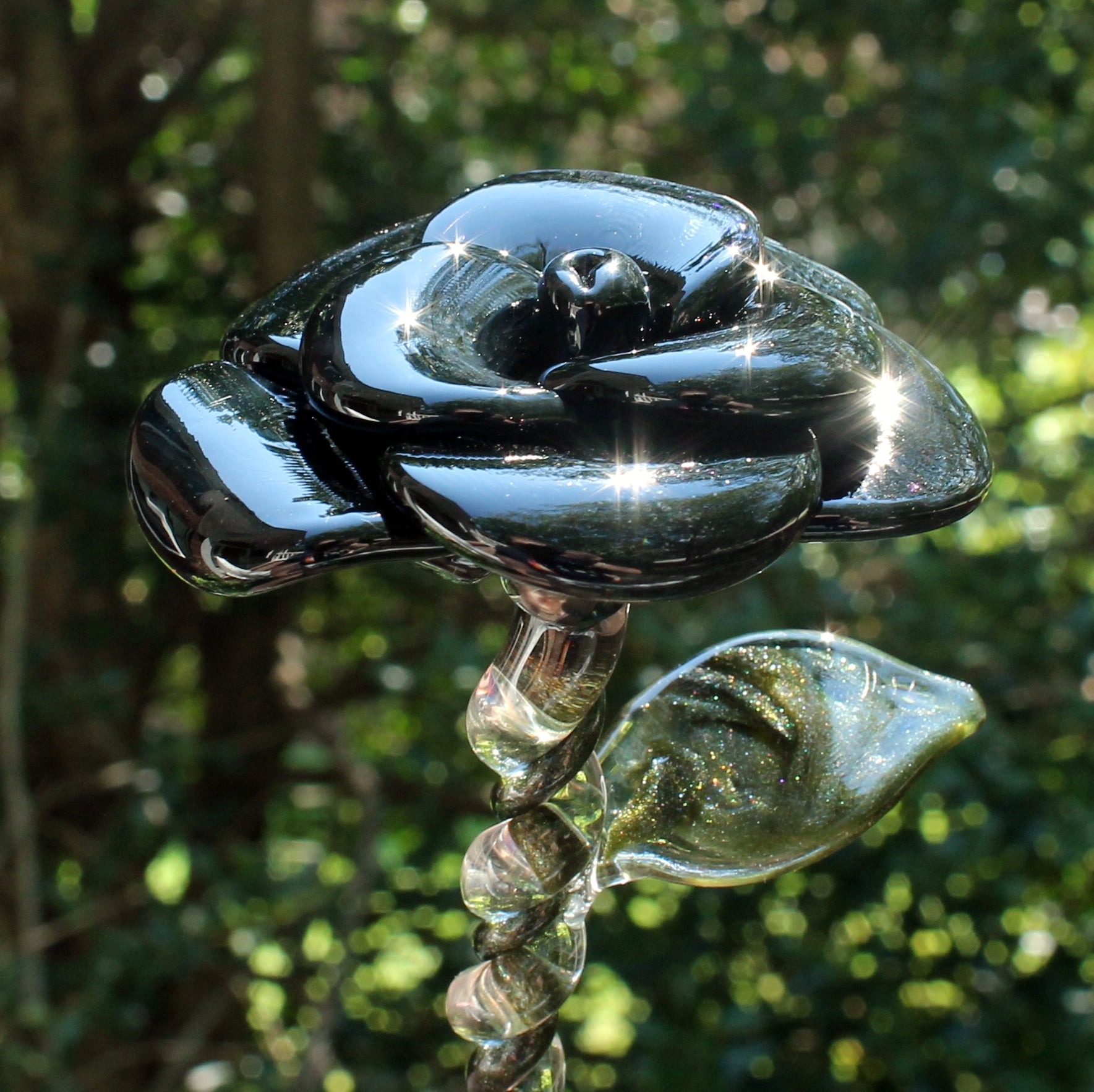 Lampwork black glass rose in the sunlight