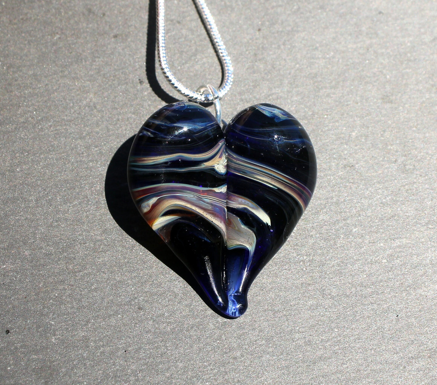 Ribbons of purple on a Blue Heart