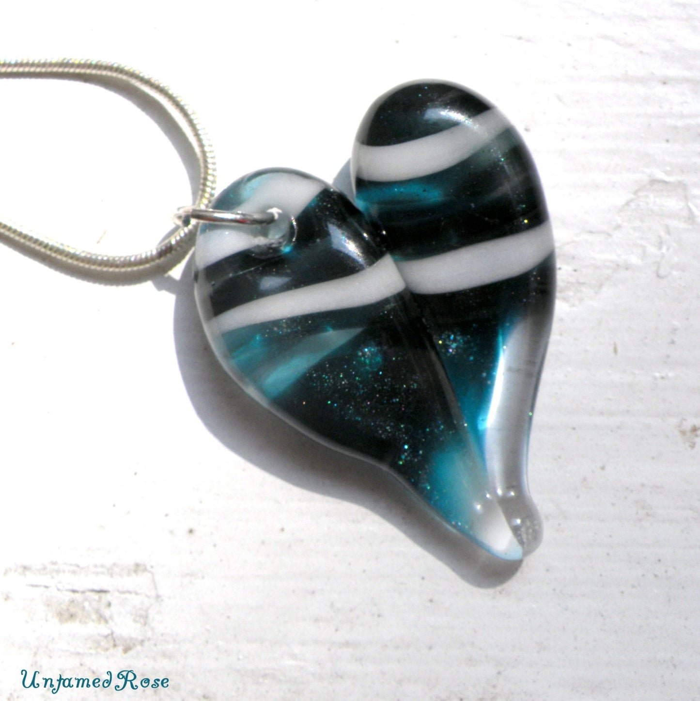 Sparkling Blue Twisted White Heart Pendant